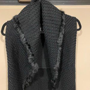 Black fur-trimmed sweater vest for holidays
